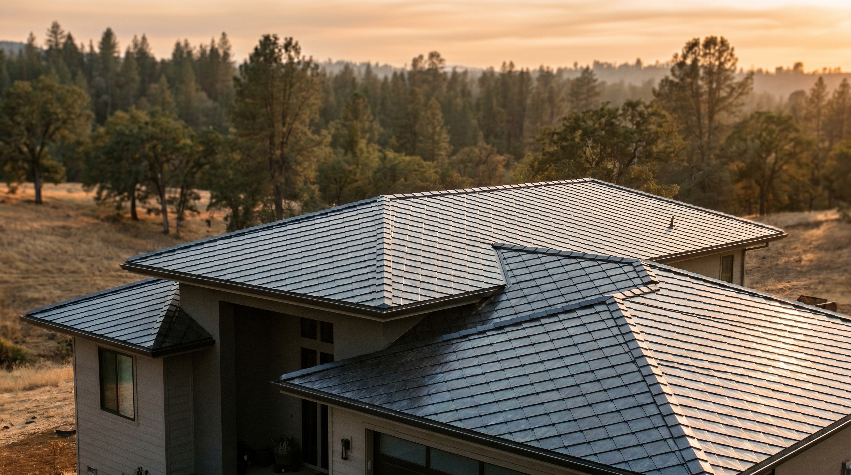 Completed SunStyle integrated PV diamond-pattern tile installation on a modern Auburn home, pine forest background.